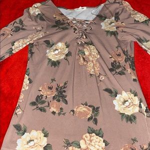 A long sleeve light pink shirt with flowers